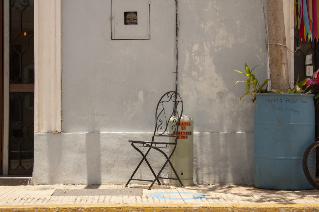 Iron chair, outside a Centro home.